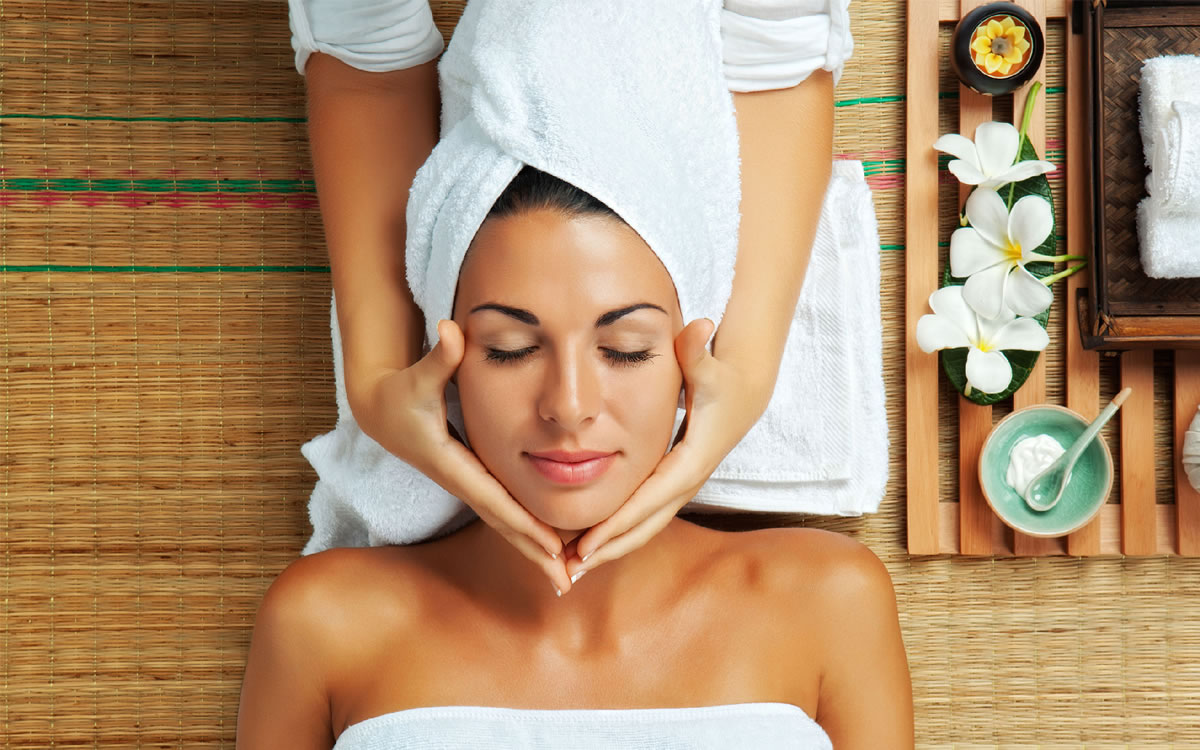 Woman receiving a facial treatment